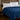 Blue breathable cooling comforter styled on a bedroom bed