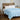 Light blue lightweight cooling comforter styled on a bedroom bed