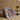 Pink ripple plush blanket draped over an armchair in a cozy living room