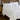 White breathable cooling comforter styled on a bedroom bed