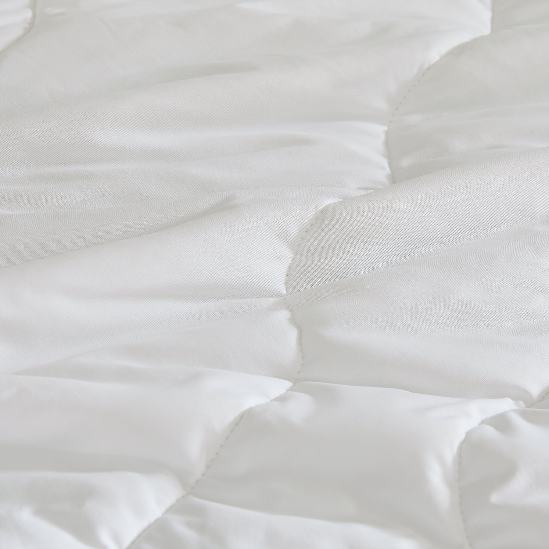 Close-up of breathable cooling comforter fabric in white